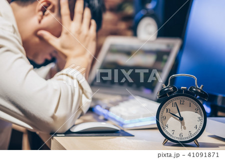 tired & headache asian businessman work overtime 41091871