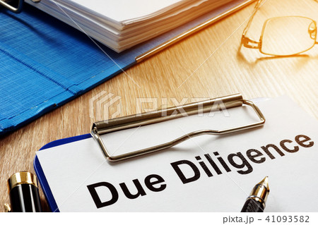 Document with title Due Diligence on a desk. 41093582