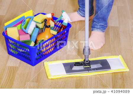 Woman uses mop on the floor Woman uses mop on the floor 41094089