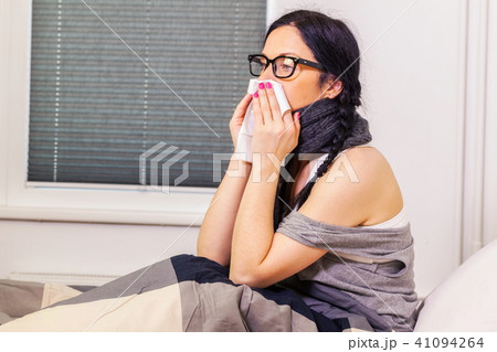Sick woman try to stop runny nose Sick woman try to stop runny nose 41094264