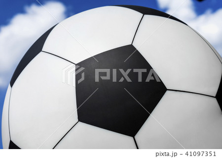 Soccer ball against blue sky with white clouds, texture, for sport background 41097351