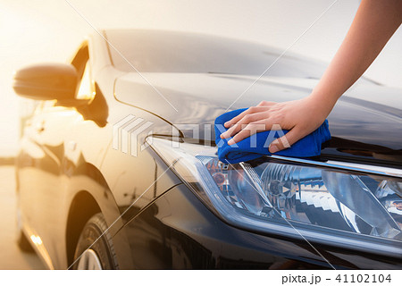 Close up portrait of woman hand cleaning a car Close up portrait of woman hand cleaning a car 41102104