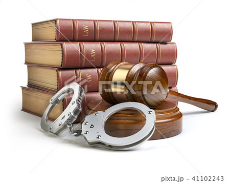 Judge gavel and handcuffs with legal book  41102243