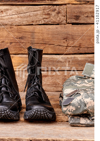 Black combat soldiers boots and clothes. 41102917
