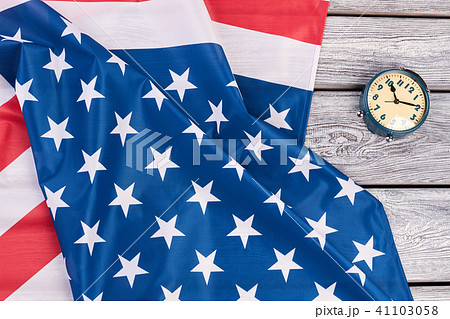 USA flag and mechanical alarm clock. USA flag and mechanical alarm clock. 41103058