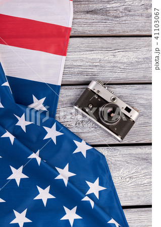 USA flag and vintage camera, top view. USA flag and vintage camera, top view. 41103067