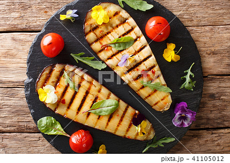 Summer appetizer from grilled eggplants 41105012