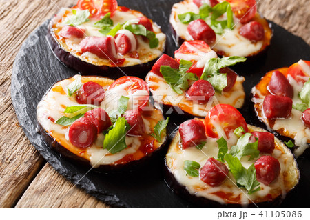 Baked eggplant with mozzarella, tomatoes 41105086