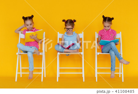 funny children girls read books on colored yellow funny children girls read books on colored yellow 41108485