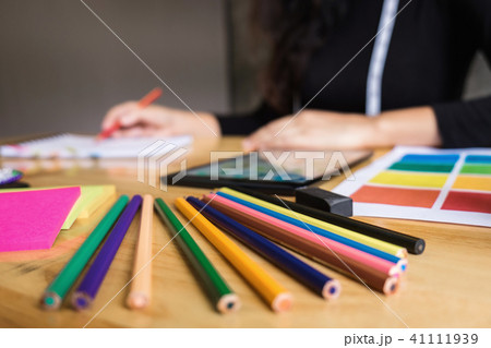 Close up of color pencil ,Young woman dressmaker or designer wor 41111939