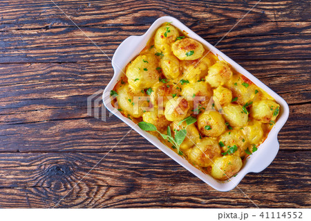 whole new potatoes baked in a dish 41114552