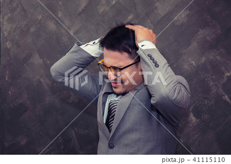Terrible headache. businessman wearing glasses Terrible headache. businessman wearing glasses 41115110