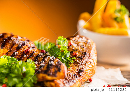 Grill chicken breast salt pepper parsley and herbs Grill chicken breast salt pepper parsley and herbs 41115282