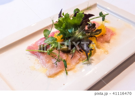 Fish Carpaccio of yellowtail with salad Fish Carpaccio of yellowtail with salad 41116470