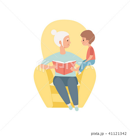 Grandma sitting in the armchair and reading book to her little grandson, grandmother spending time 41121342