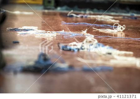 Weaving background with wool on the floor Weaving background with wool on the floor 41121371