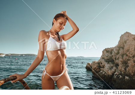 woman in bikini on sea background 41123069