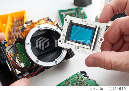 Image sensor digital SLR camera in hands Image sensor digital SLR camera in hands 41124659