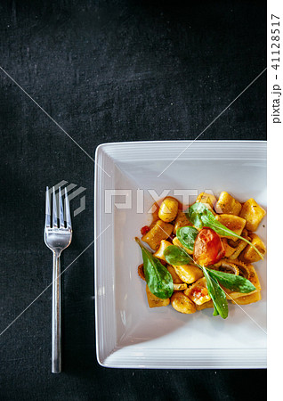 Potato gnocchi with spinach octopus and parmesan 41128517