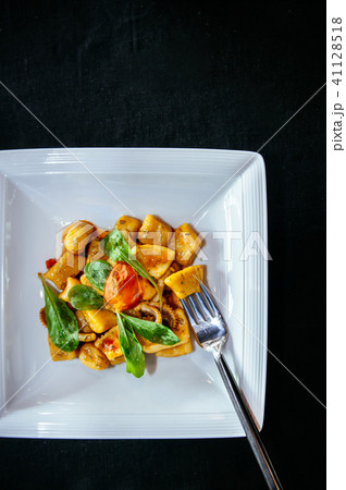 Potato gnocchi with spinach octopus and parmesan 41128518