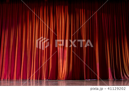 Red curtains and stage. 41129202