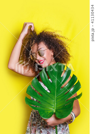 Beautiful Girl selfie with a smartphone. Beautiful young African American woman with afro hairstyle 41130434