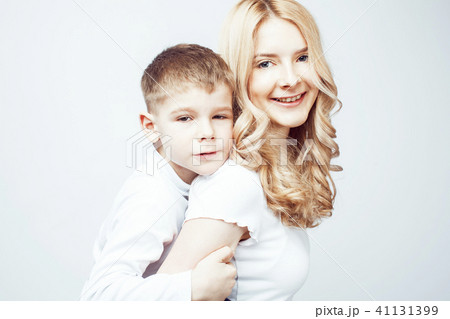 young modern blond curly mother with cute son together happy smi 41131399