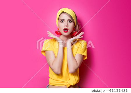 Young redhead girl in yellow clothes 41131481