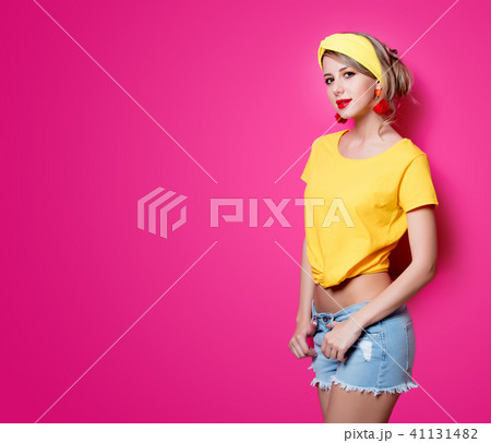 Young redhead girl in yellow clothes 41131482