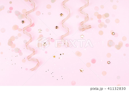 Golden decorations on pink pastel background. 41132830