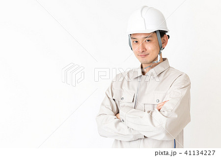 作業服を着た男性 白バックイメージの写真素材