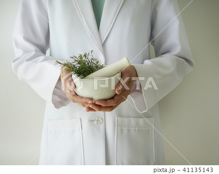 scientist or doctor making herbal medicine  41135143