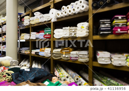different fabric bolts exposed on shelves different fabric bolts exposed on shelves 41136956