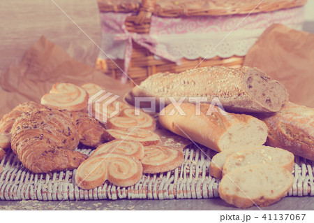 Various kinds of bread and bakery products on table 41137067