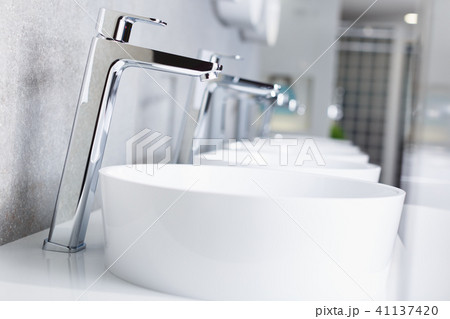 Picture of ceramic wash basin with chrome tap in store Picture of ceramic wash basin with chrome tap in store 41137420