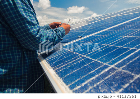 engineer team working on replacement solar panel engineer team working on replacement solar panel 41137561