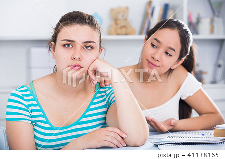 Girl trying to apologize to friend 41138165