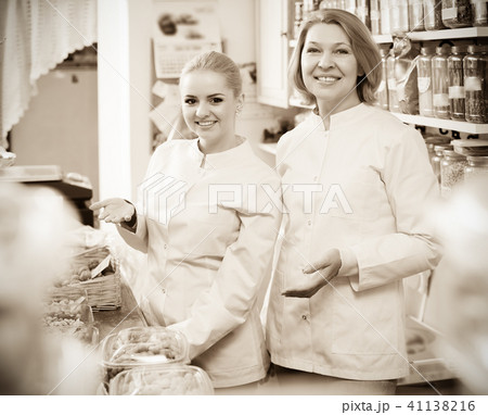 Female selling nuts and pastry 41138216