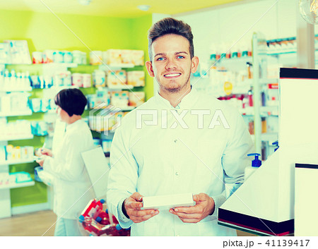 Portrait of two friendly positive pharmacists Portrait of two friendly positive pharmacists 41139417