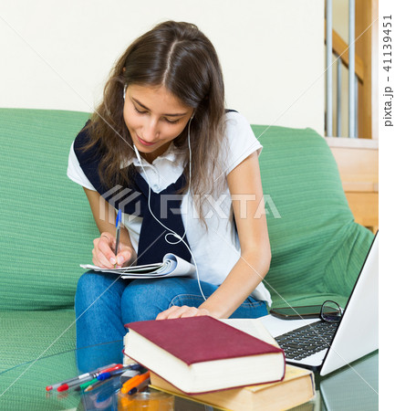 Teenager girl doing homework 41139451