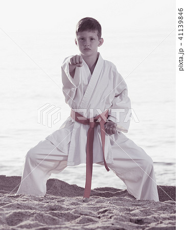 Boy practising karate at seaside 41139846