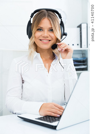 Friendly girl technical support person or call center manager in the office 41140700