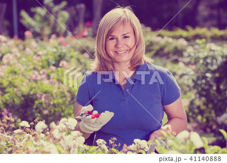 mature woman in garden on summer day. 41140888