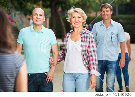 Couples of mature males and females walking on holiday Couples of mature males and females walking on holiday 41140926