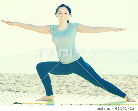 Pretty young girl training yoga poses Pretty young girl training yoga poses 41141713