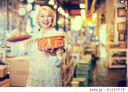 woman buying ceramic ware woman buying ceramic ware 41143579