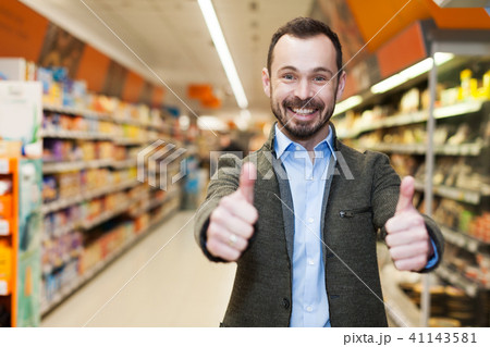 smiling man who is satisfied shopping smiling man who is satisfied shopping 41143581
