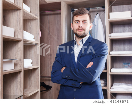 Confident sales manager in dressing room Confident sales manager in dressing room 41143671