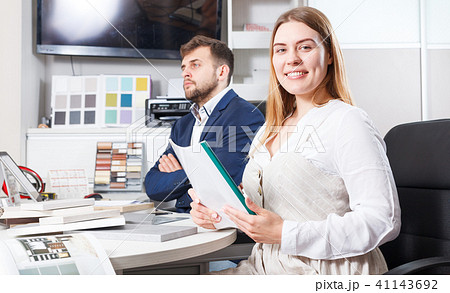 Woman planning furniture with seller Woman planning furniture with seller 41143692