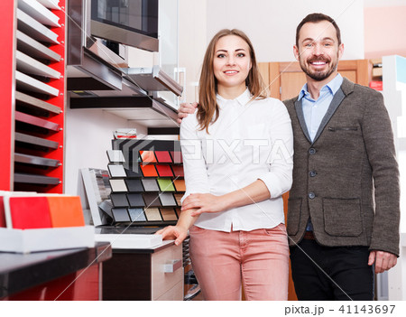 Family couple in kitchen furniture salon 41143697